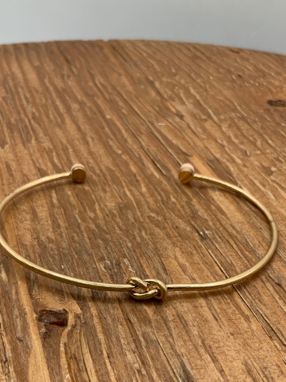 Plunder Design Gold Tone Knot Pink Accent Open Cuff Bracelet